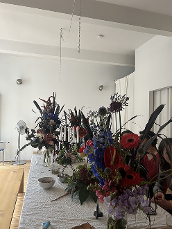 Elaborate floral arrangement in minimalist space
